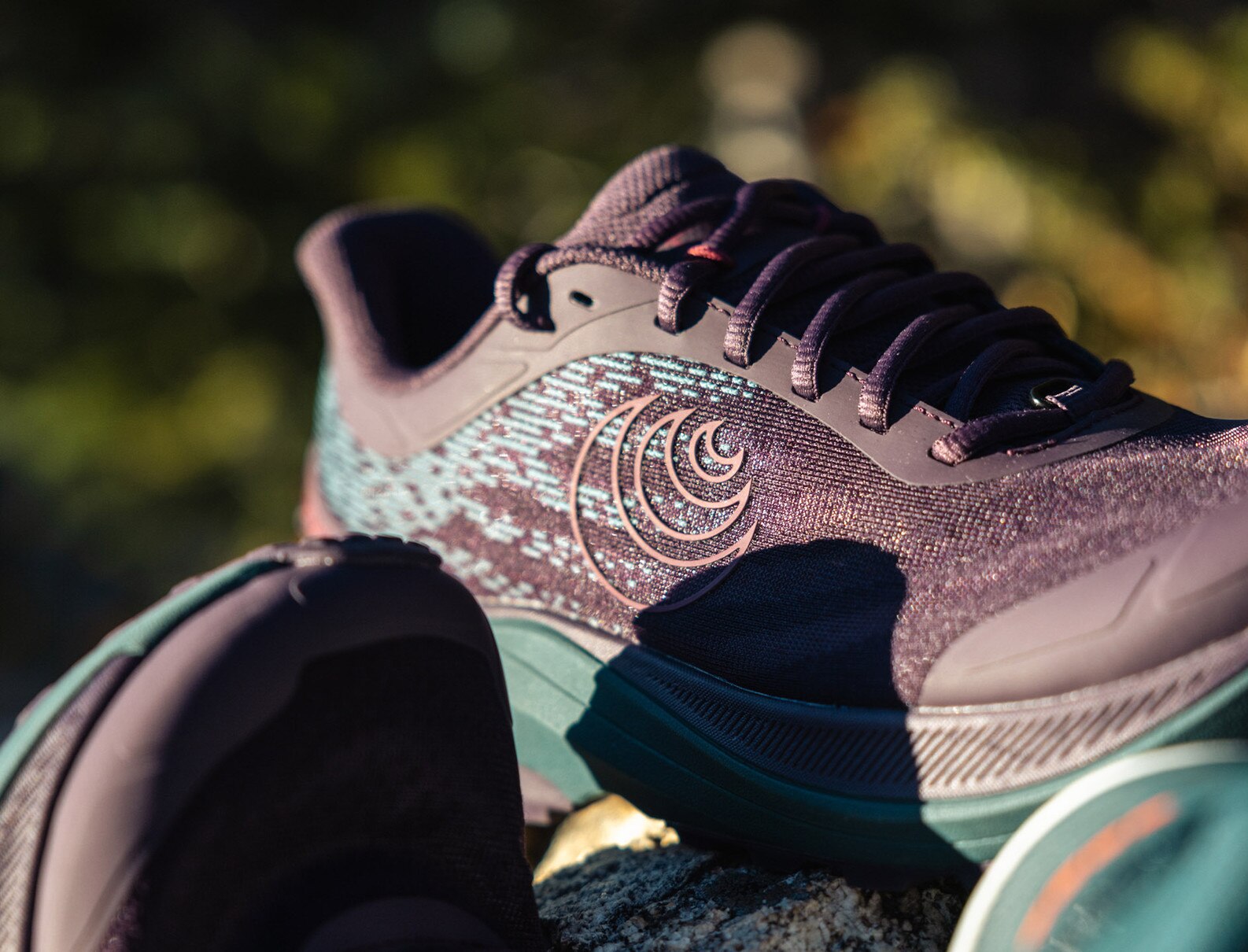 Close-up of Topo Athletic Ultraventure 4 women's trail running shoes, showcasing durable design and superior grip for trail adventures
