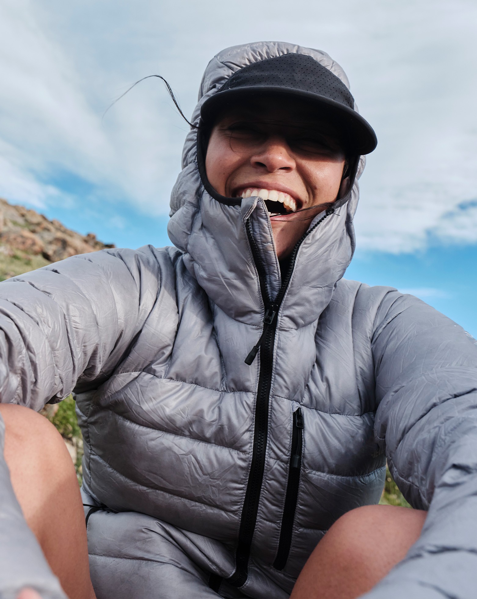 A person wearing Topo gaiters outside