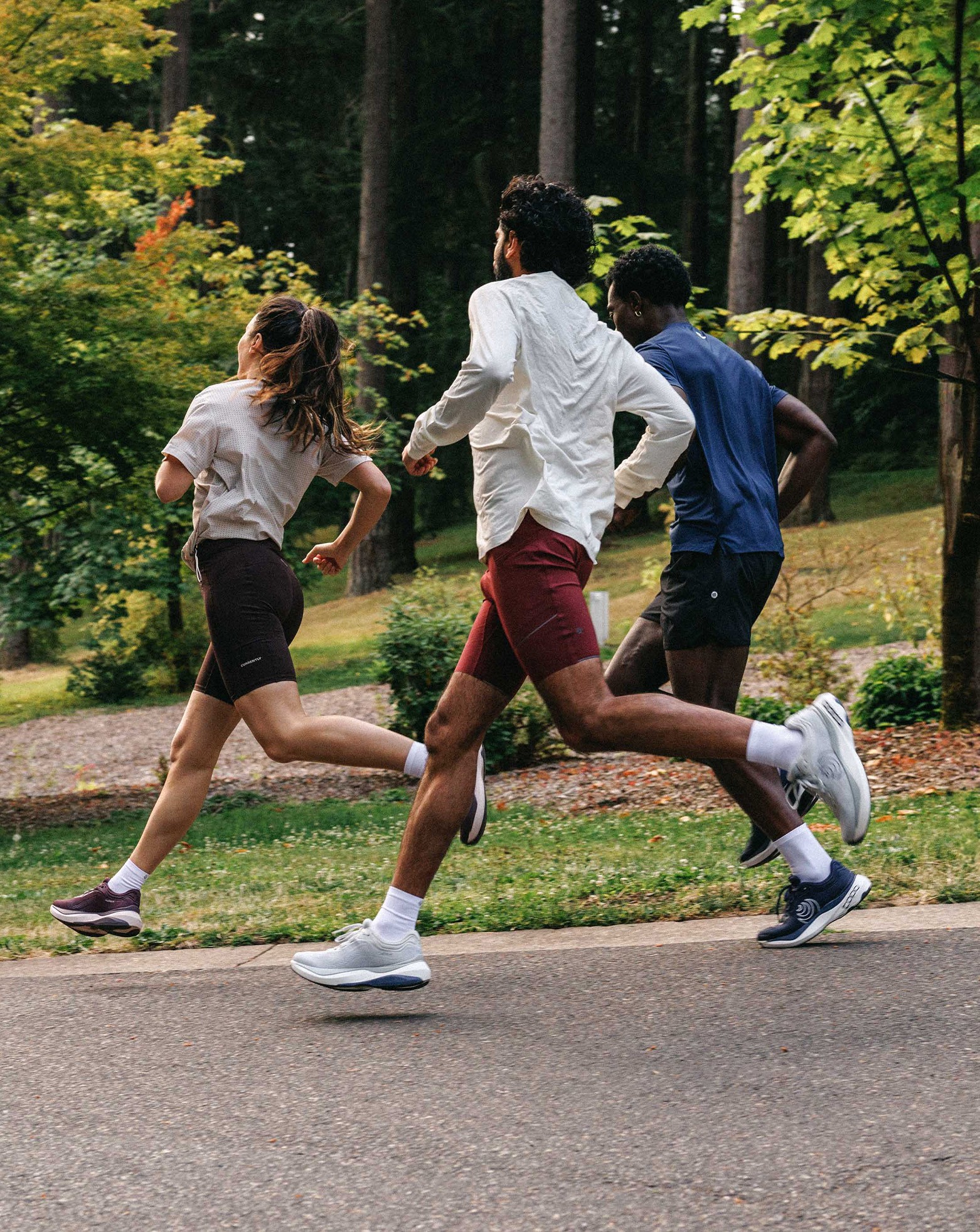 People smiling and running outside in the city