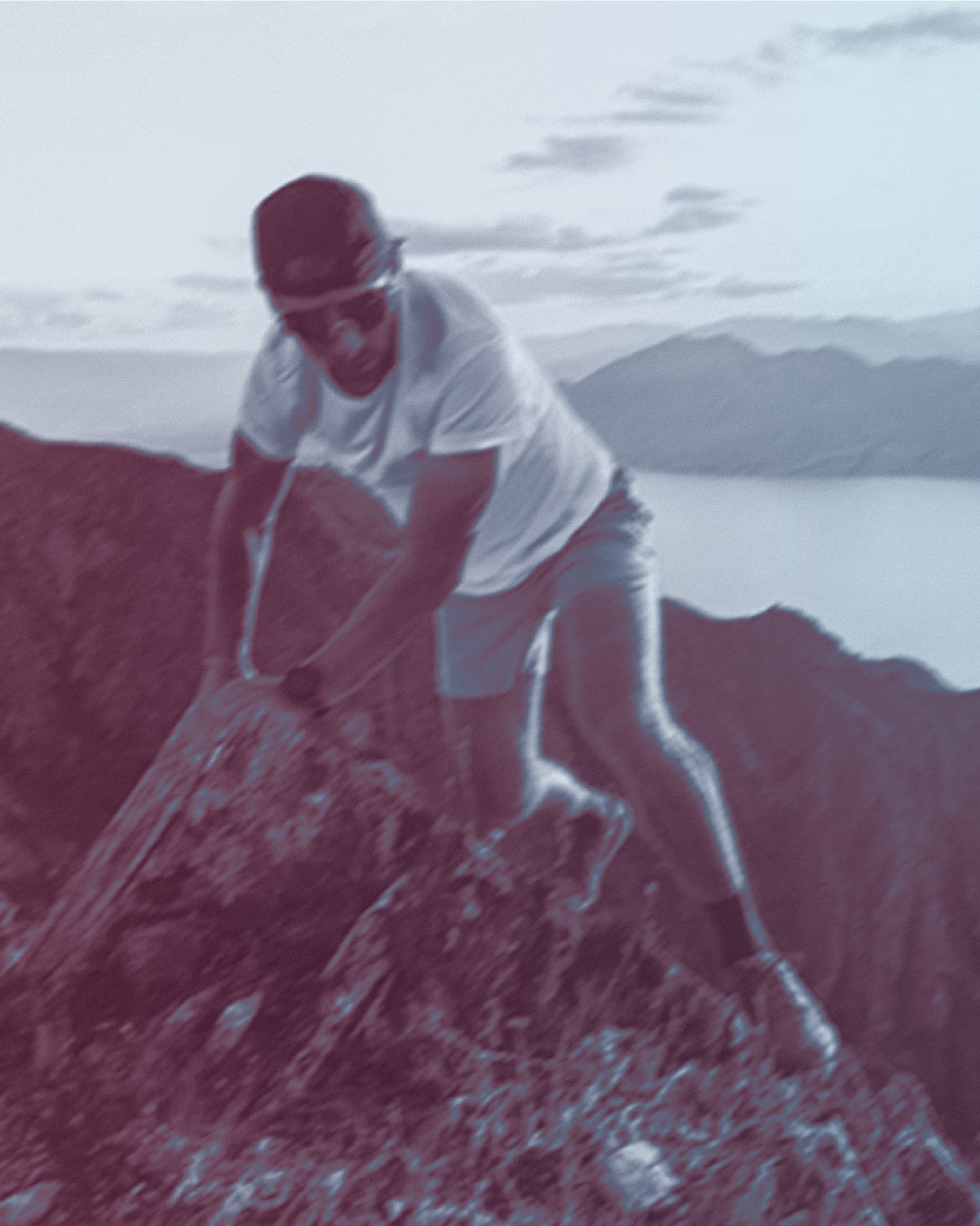 A hiker sitting on a rock showing the shoe outsole